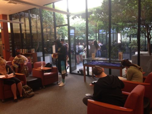 Students writing poetry inside and outside the atrium, our “Idea Box” of sorts at Pearson Library