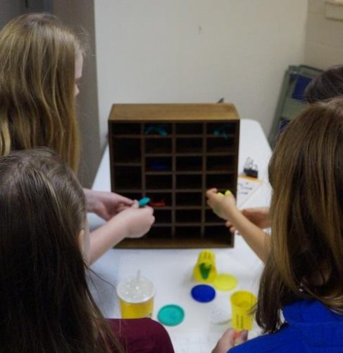 Library Lockdown participants working together to create a puzzle with Play-Dough; Morton-James Public Library (CC-BY 4.0)